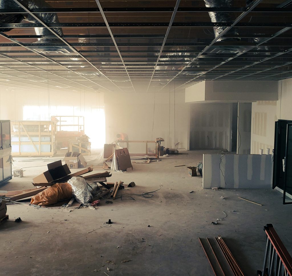 Restaurant owner and contractor reviewing a Los Angeles restaurant space before signing a lease.